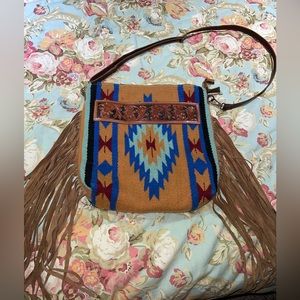 Brand new American darling purse. Leather tooled. Fringe multi color